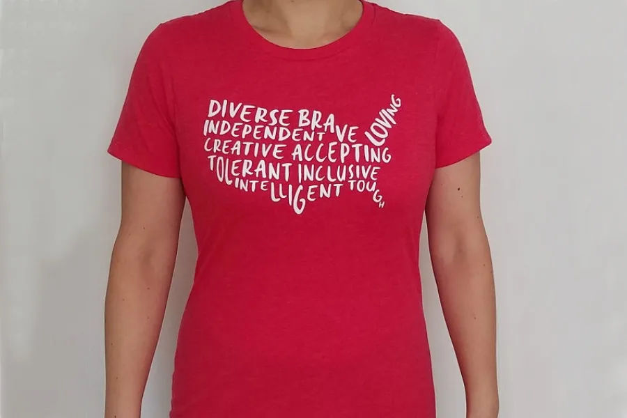 Progressive 4th of July shirts you'll want to wear all year: "America is..." shirt from Brave New Worlds Designs supporting Americares
