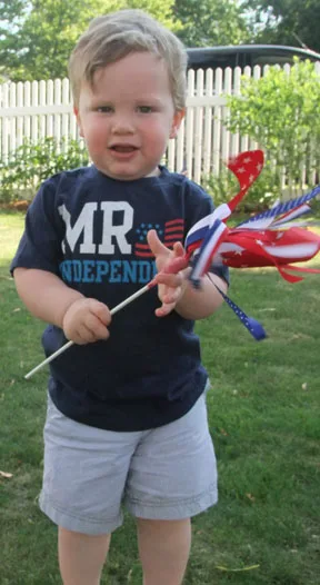 child with firework ribbon wand
