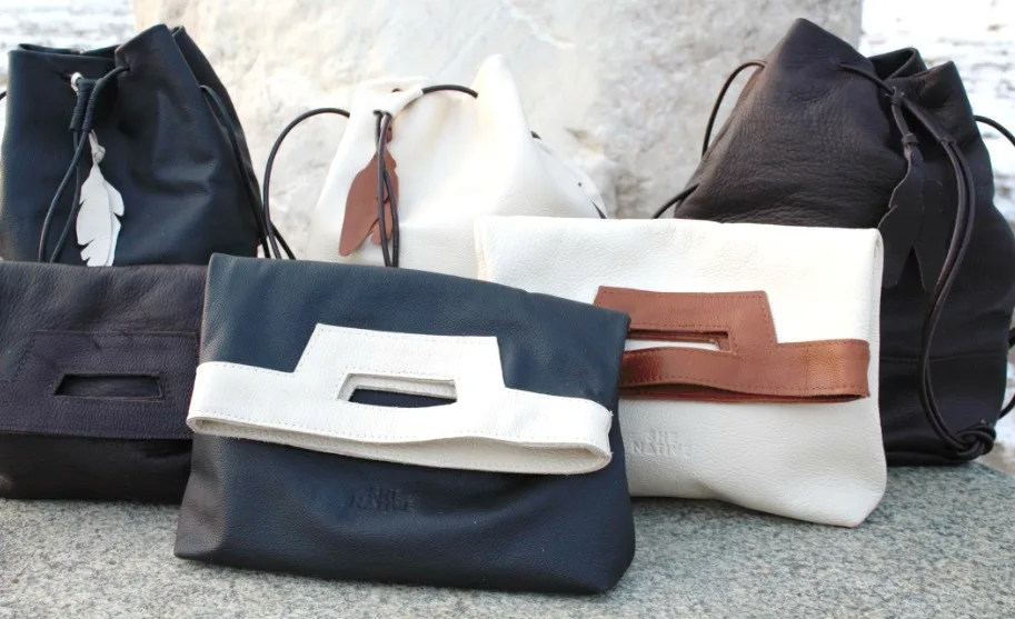 SheNatie handmade envelope clutches and bucket bags, providing opportunities to Native North American women
