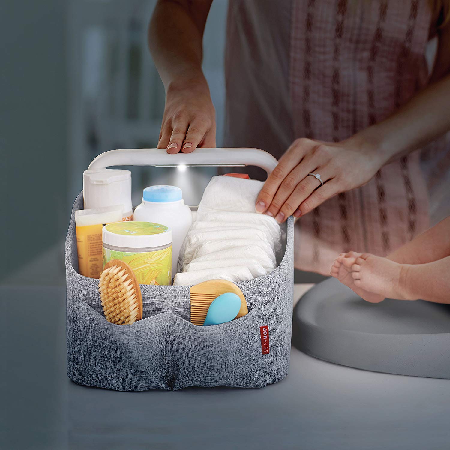 Best baby gear for twins: The Skip Hop light-up diaper caddy makes it easy to find what you need without waking up both babies.