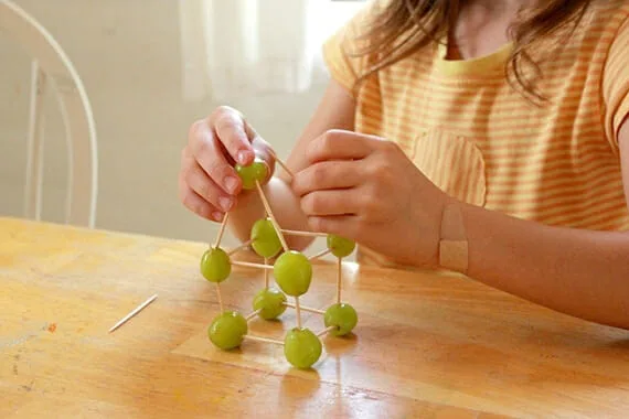 Build edible grape structures at Artful Parent