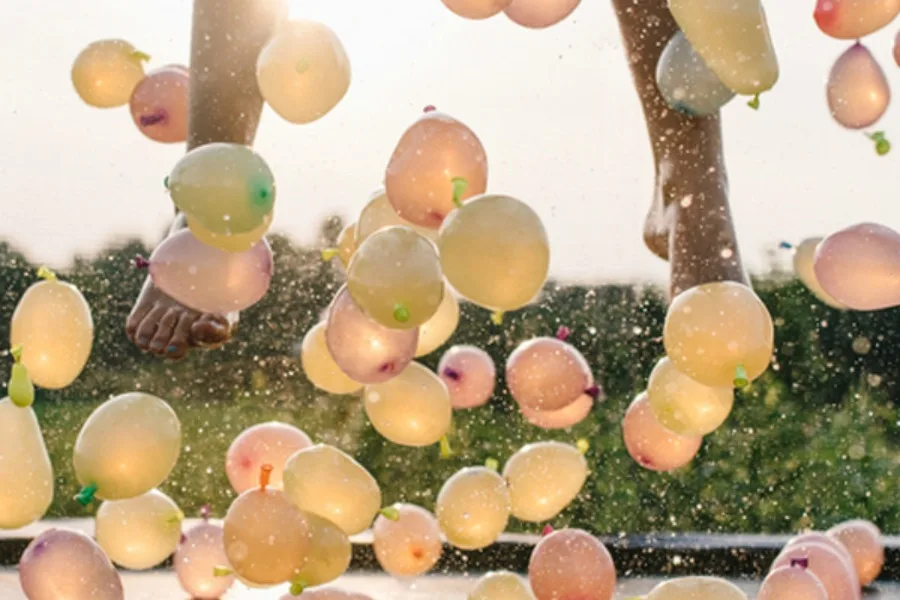 Summer water activities for the backyard: Water Balloon Trampoline Jumping by A Subtle Revelry