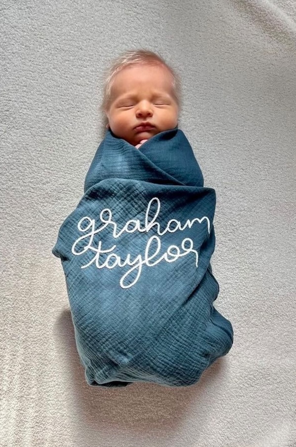 Best personalized baby gifts: Hand-embroidered personalized baby swaddle from Limber & Linden Co