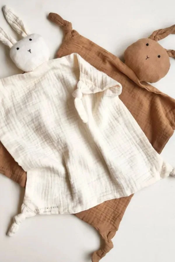 Corolle's baby doll has bunny ears and smells like vanilla.