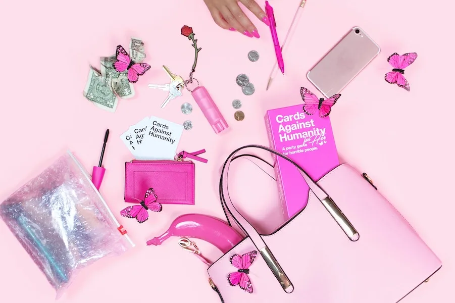 Cards Against Humanity for Her...it's pink! That's how you know it's for her! (Also proceeds donated to an amazing cause )