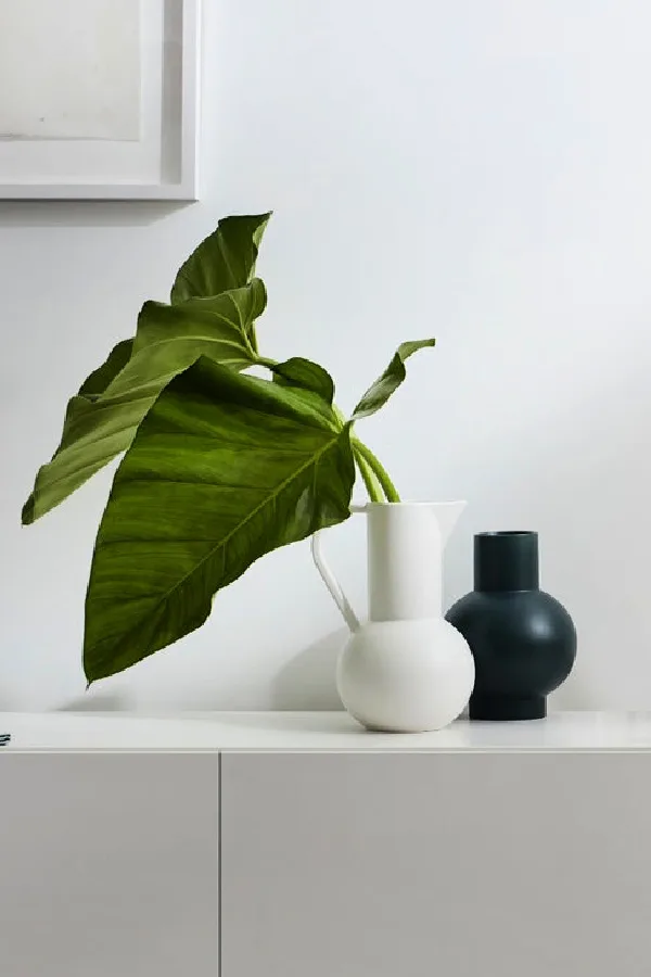 Easy ways to freshen up your family room: Get rid of piles of junk and replace with objects you like looking at. Like this Raawii Strom vase
