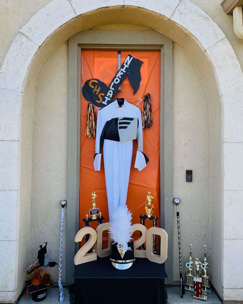 Graduation ideas during Covid-19: Decorating your front door with representations of your child's accomplishments | Niko Morales for GMA