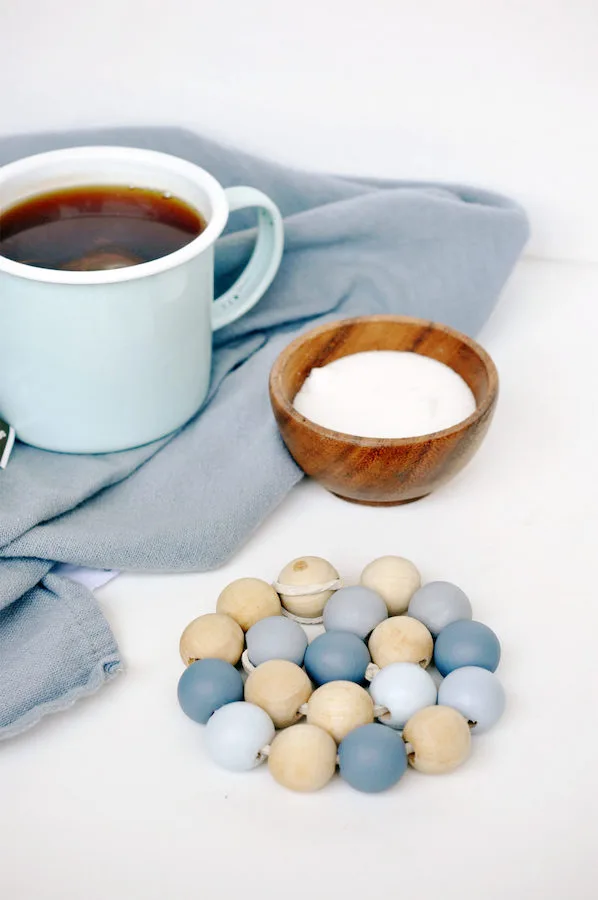 Pretty DIY wooden bead coasters from Lark & Linen can be customized for to match their decor