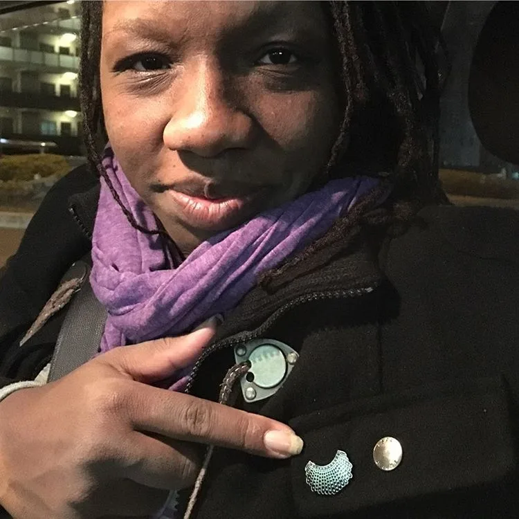 RGB Dissent Collar Pin worn by Ammenah - accessorizing meets activism!