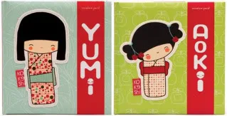 Two adorable Kokeshi dolls that are made to be read