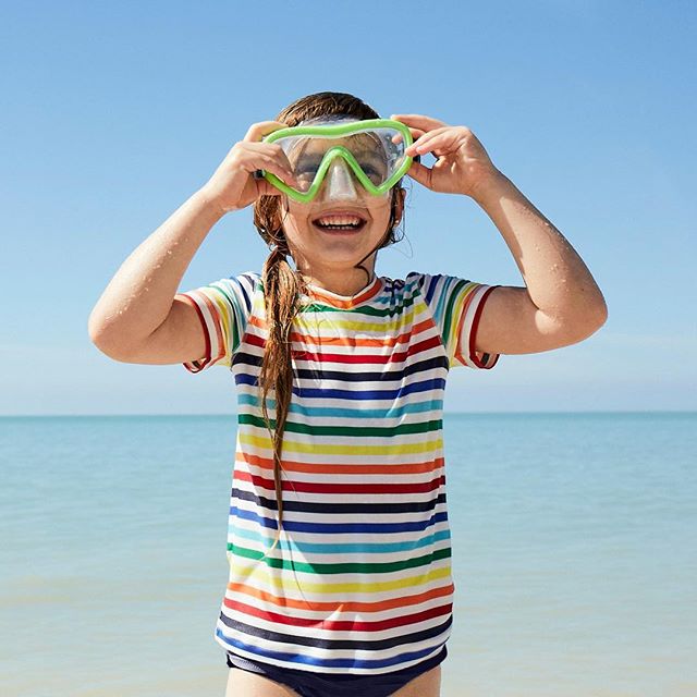 Primary swimwear for kids in solids, color blocks, and rainbow stripes - great prices, and they hold up beautifully!