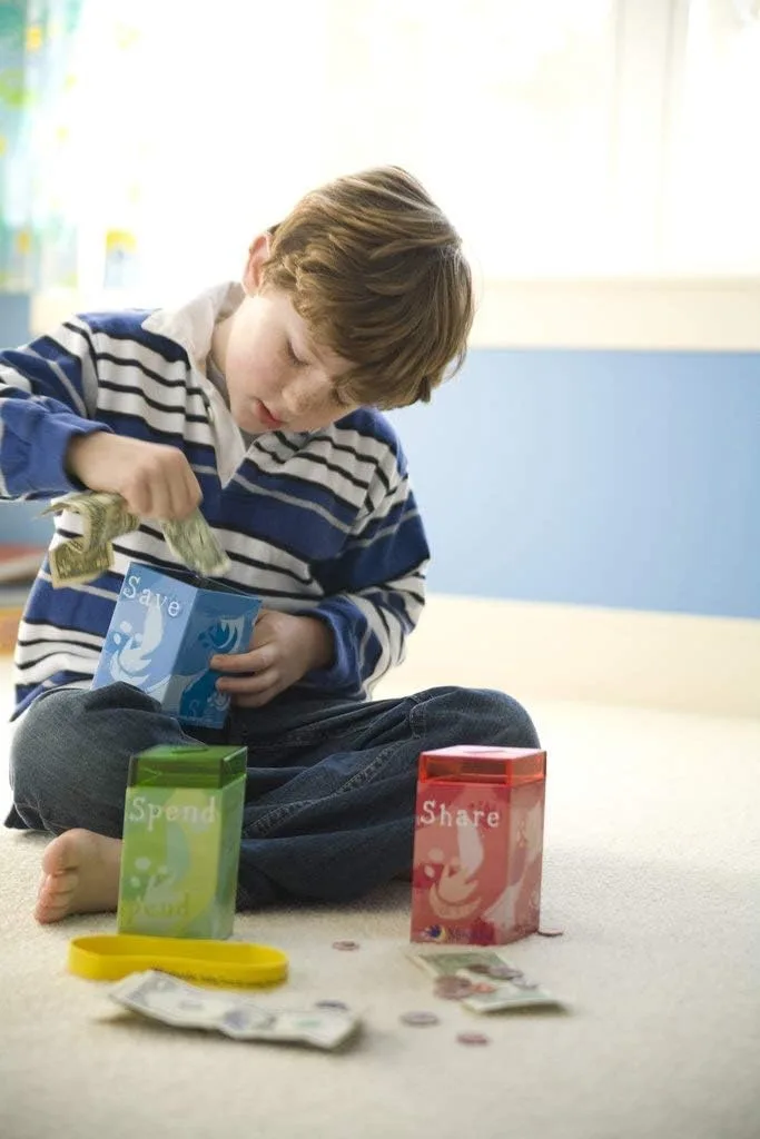 Teaching kids about money with a personalized piggy bank from 2BWoodKids on Etsy