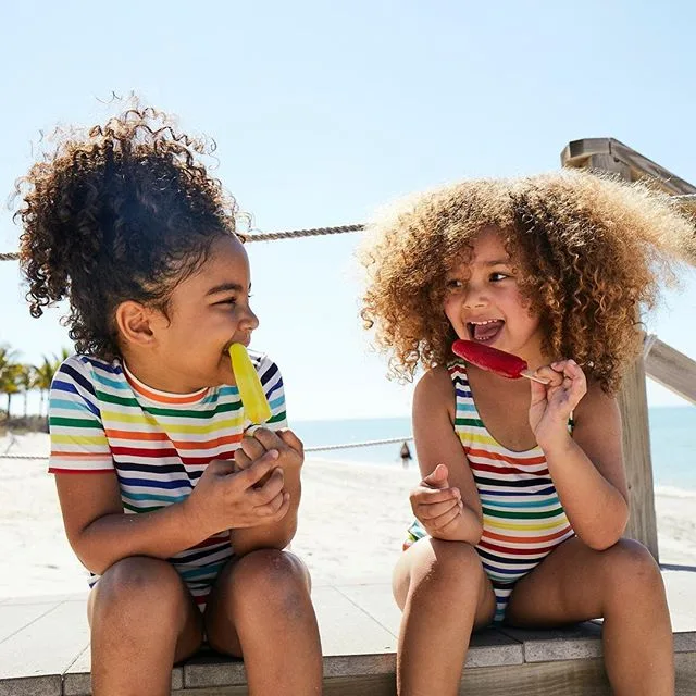 Primary swimwear for kids made from durable UPF50 fabrics, and they mix and match with everything!