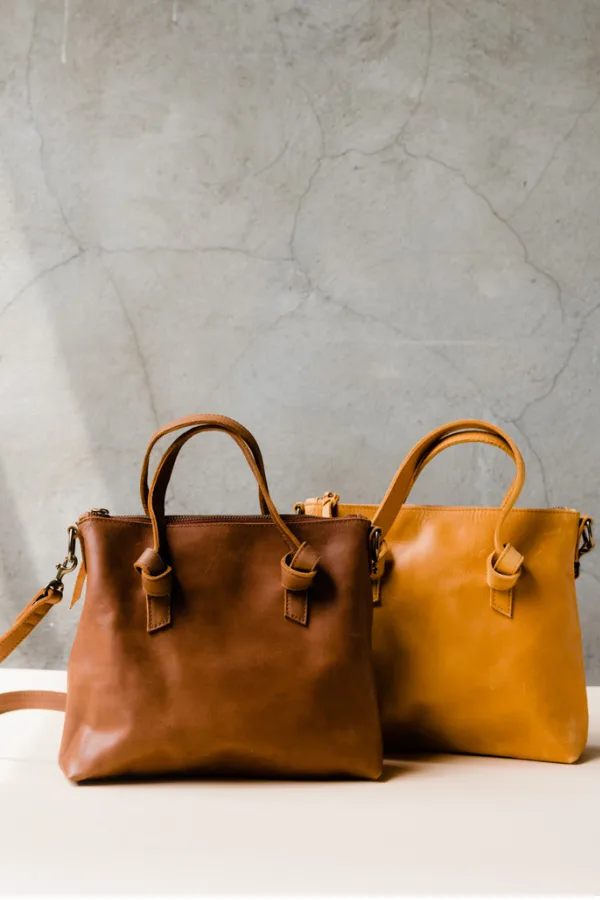 Beautiful leather crossbody bag from Able is convertible -- just tuck the shoulder strap in