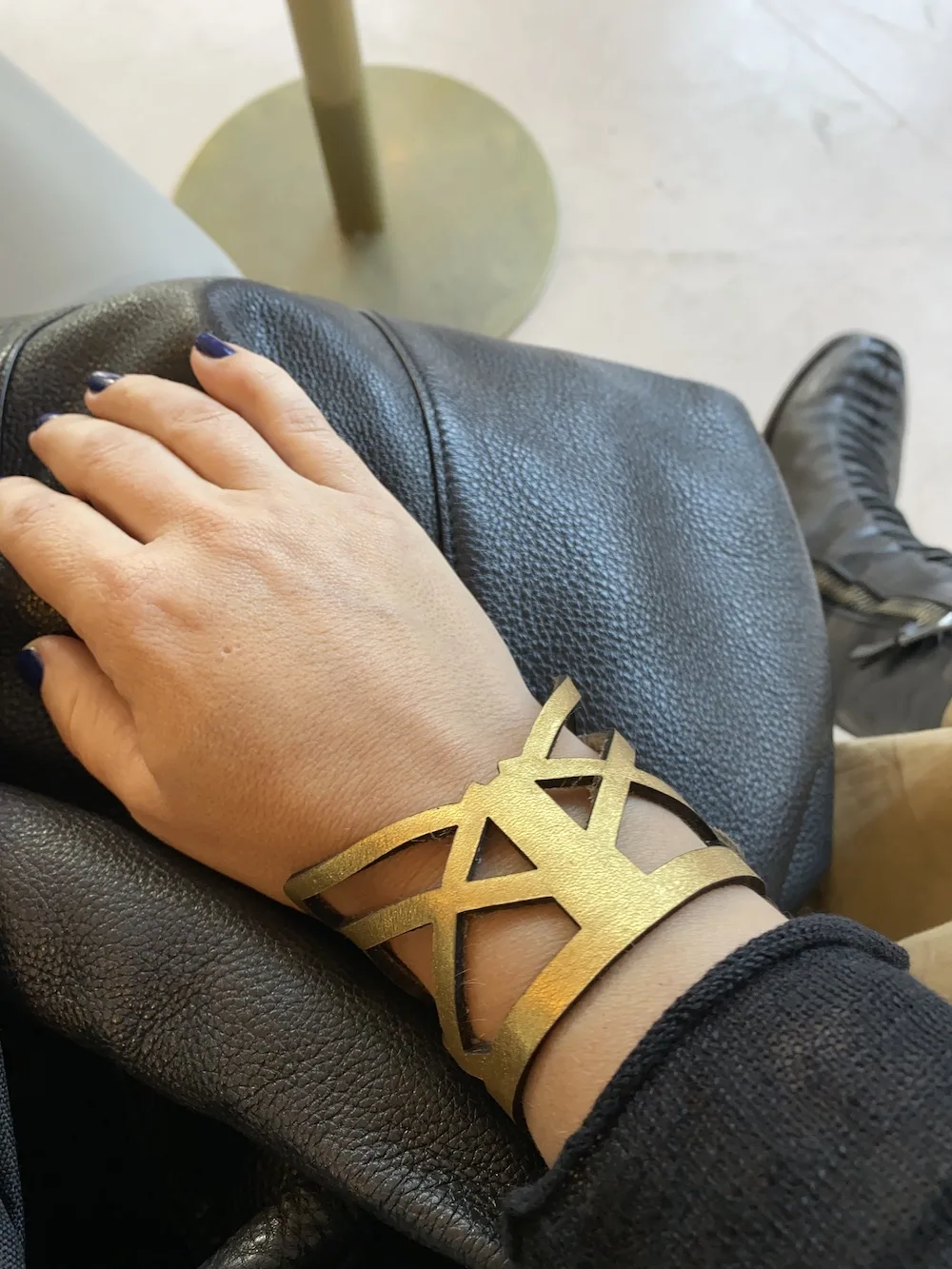 Amber Poitier gold leather cuff
