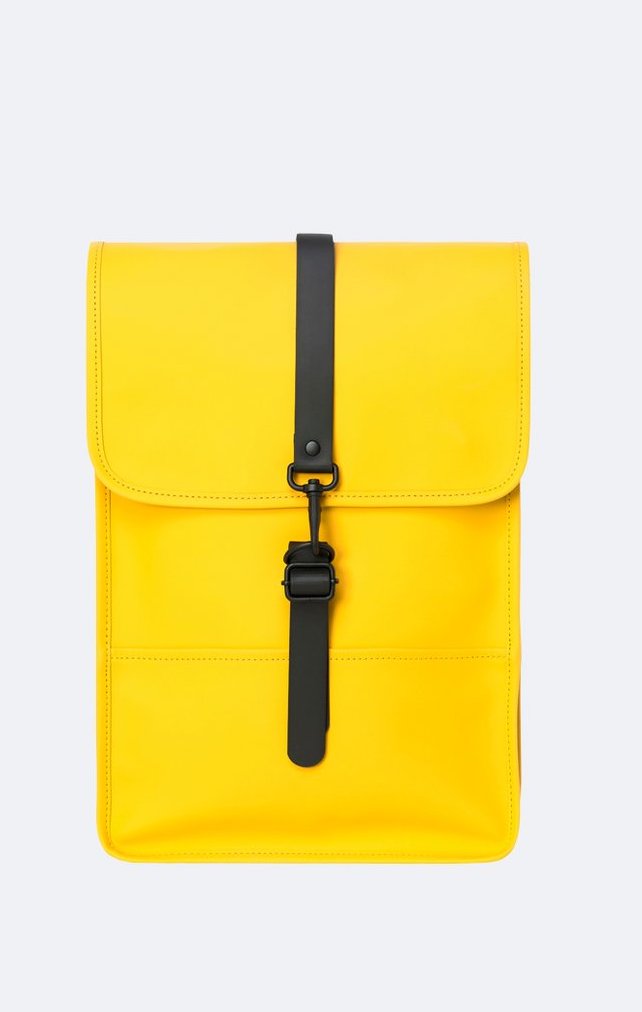 Cute summer backpacks: Rains Waterproof Mini Backpack is perfect for a laptop in Pantone's Illuminating Yellow color of 2021