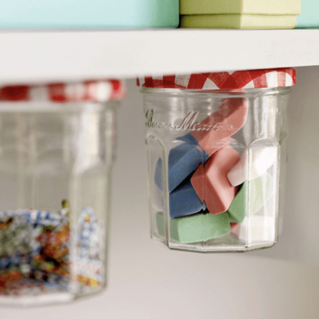 Jelly jar under-desk storage for school supplies: School supply organization hack from Lifehacks