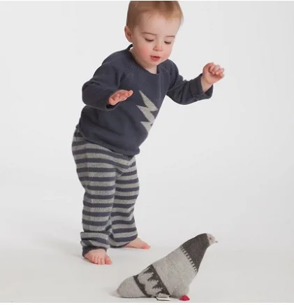 City babies wear black. And chase pigeons. And hail cabs.