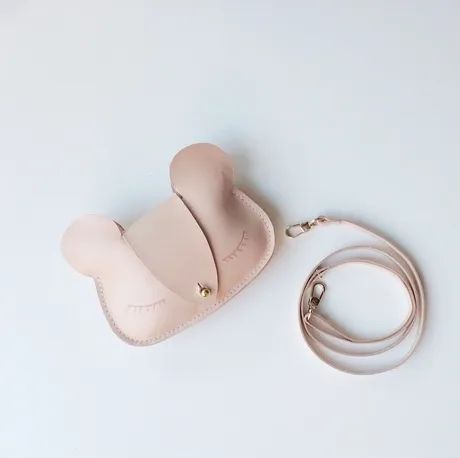 Sylvia Soo clutches are available as cute kitties or this adorable bear